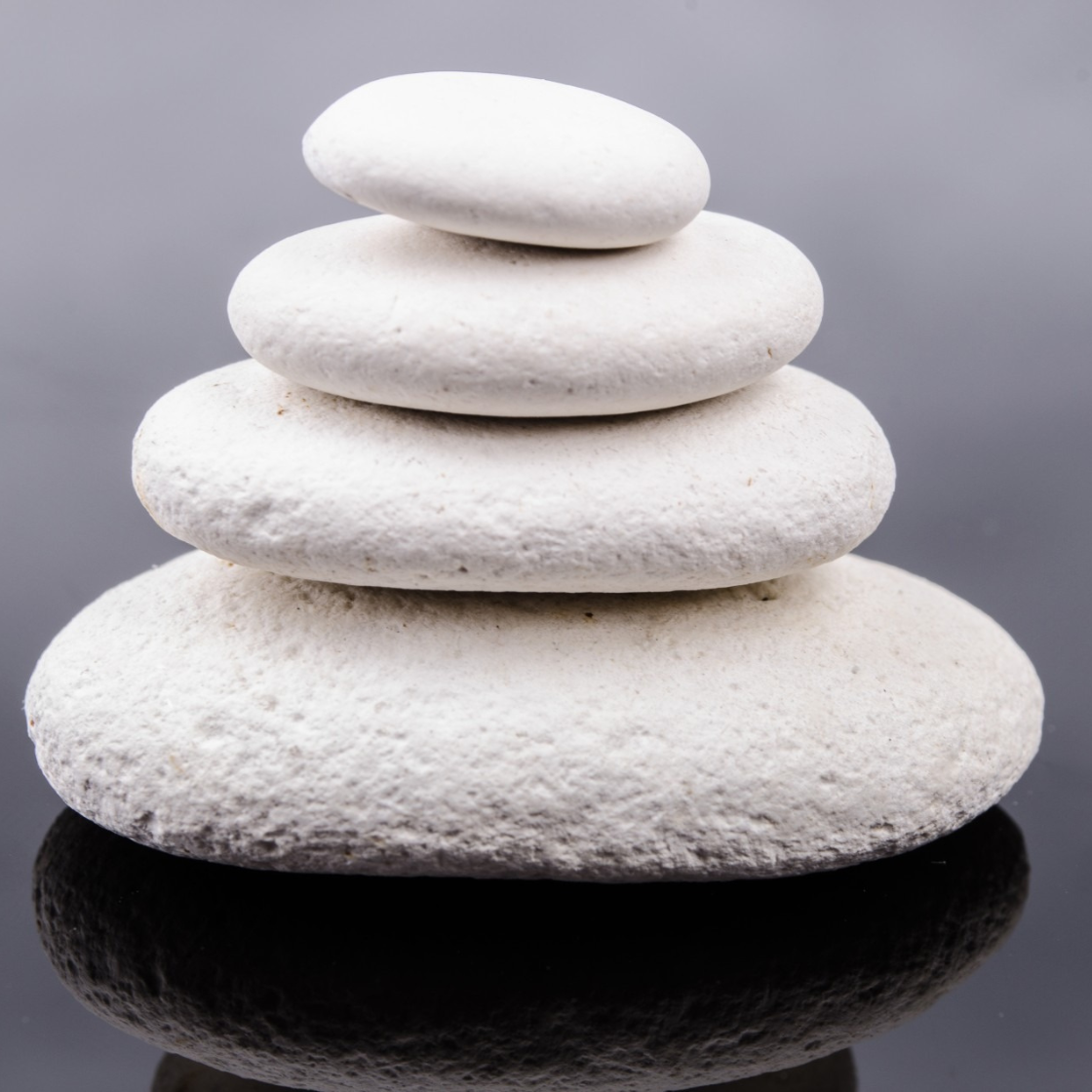 stacked stones - aligned balanced and stable A stack of stones that signifies being aligned, balanced and stable in all areas of life - health, wealth, relationships and having a purpose and direction.